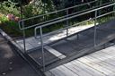 Wheelchair and accessibility ramp from the parking lot to a complex 